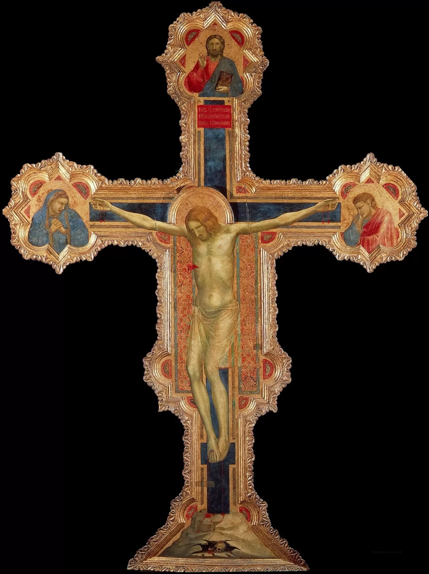 A religious cross with a crucifix Description automatically generated