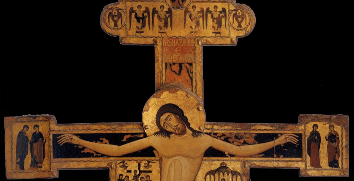 A religious cross with a crucifix Description automatically generated