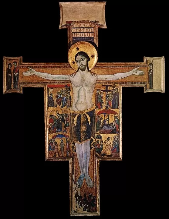 A religious cross with a crucifixion Description automatically generated